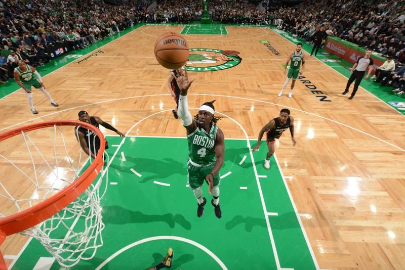 BOSTON, MA - APRIL 24: Jrue Holiday #4 of the Boston Celtics goes to the basket during the game against the Miami Heat  during Round 1 Game 2 of the 2024 NBA Playoffs on April 24, 2024 at the TD Garden in Boston, Massachusetts. NOTE TO USER: User expressly acknowledges and agrees that, by downloading and or using this photograph, User is consenting to the terms and conditions of the Getty Images License Agreement. Mandatory Copyright Notice: Copyright 2024 NBAE  (Photo by Brian Babineau/NBAE via Getty Images)