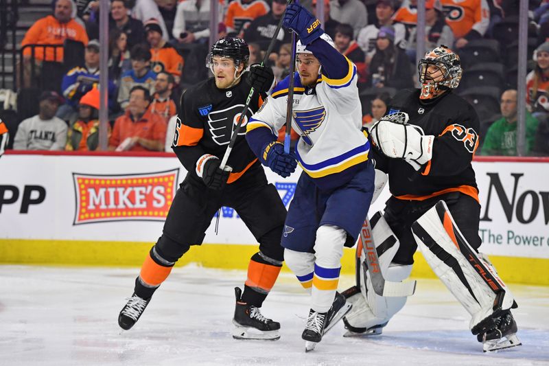 Mar 4, 2024; Philadelphia, Pennsylvania, USA; Philadelphia Flyers defenseman Travis Sanheim (6) battles with St. Louis Blues left wing Pavel Buchnevich (89) in front of goaltender Samuel Ersson (33) during the first period at Wells Fargo Center. Mandatory Credit: Eric Hartline-USA TODAY Sports