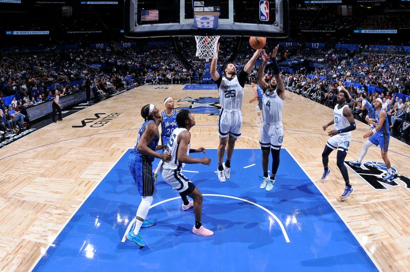 ORLANDO, FL - MARCH 30: Maozinha Pereira #25 of the Memphis Grizzlies rebounds the ball during the game against the Orlando Magic on March 30, 2024 at the Kia Center in Orlando, Florida. NOTE TO USER: User expressly acknowledges and agrees that, by downloading and or using this photograph, User is consenting to the terms and conditions of the Getty Images License Agreement. Mandatory Copyright Notice: Copyright 2024 NBAE (Photo by Fernando Medina/NBAE via Getty Images)