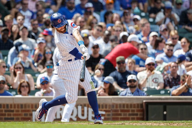 May 5, 2023; Chicago, Illinois, USA; Chicago Cubs shortstop Dansby Swanson (7) singles against the Miami Marlins during the fifth inning at Wrigley Field. Mandatory Credit: Kamil Krzaczynski-USA TODAY Sports