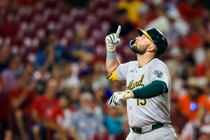 Aug 28, 2024; Cincinnati, Ohio, USA; Oakland Athletics first baseman Seth Brown (15) reacts after hitting a three-run home run in the eighth inning against the Cincinnati Reds at Great American Ball Park. Mandatory Credit: Katie Stratman-USA TODAY Sports