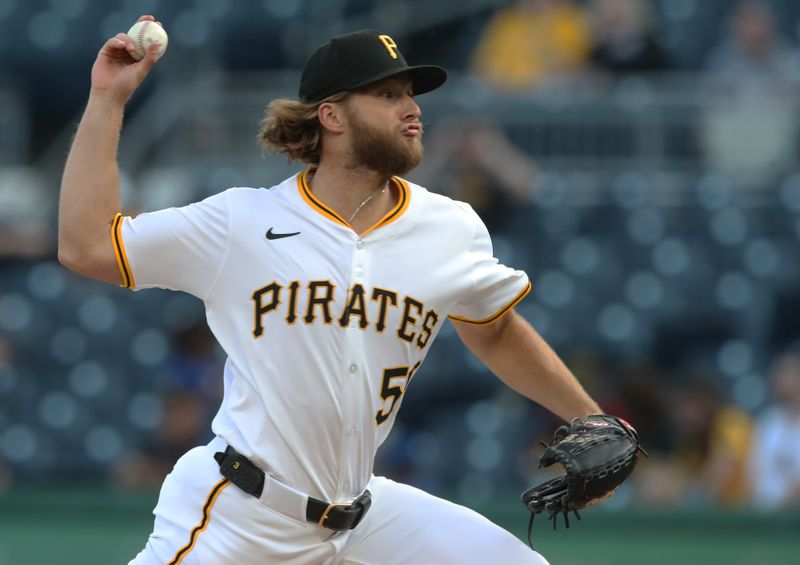 Apr 30, 2025; Pittsburgh, Pennsylvania, USA;  Pittsburgh Pirates starting pitcher Carmen Mlodzinski (50) delivers a pitch against the Chicago Cubs during the first inning at PNC Park. Mandatory Credit: Charles LeClaire-Imagn Images