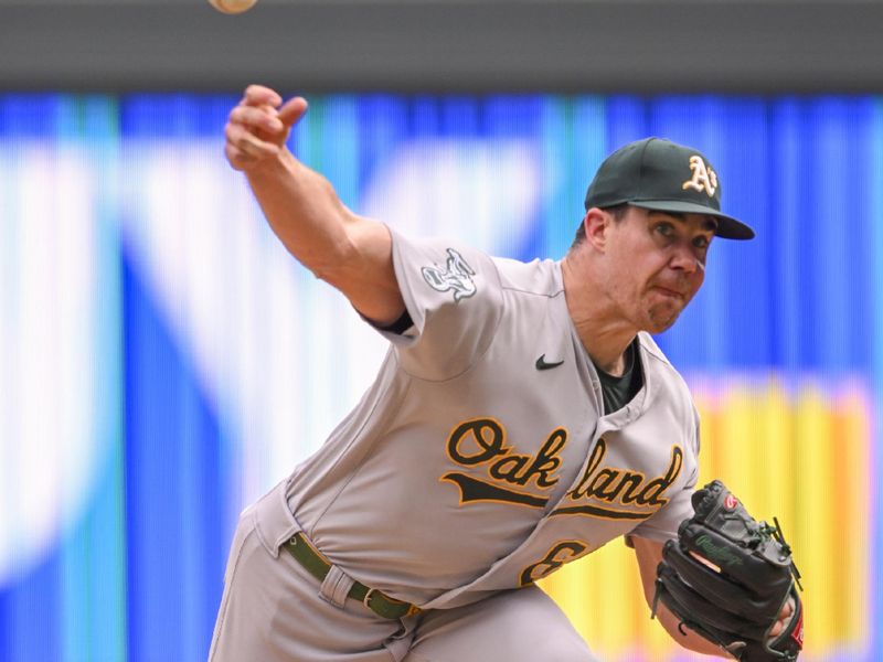 Sep 28, 2023; Minneapolis, Minnesota, USA; Oakland Athletics pitcher Trevor May (65) delivers a pitch against the Minnesota Twins during the ninth inning at Target Field. Mandatory Credit: Nick Wosika-USA TODAY Sports