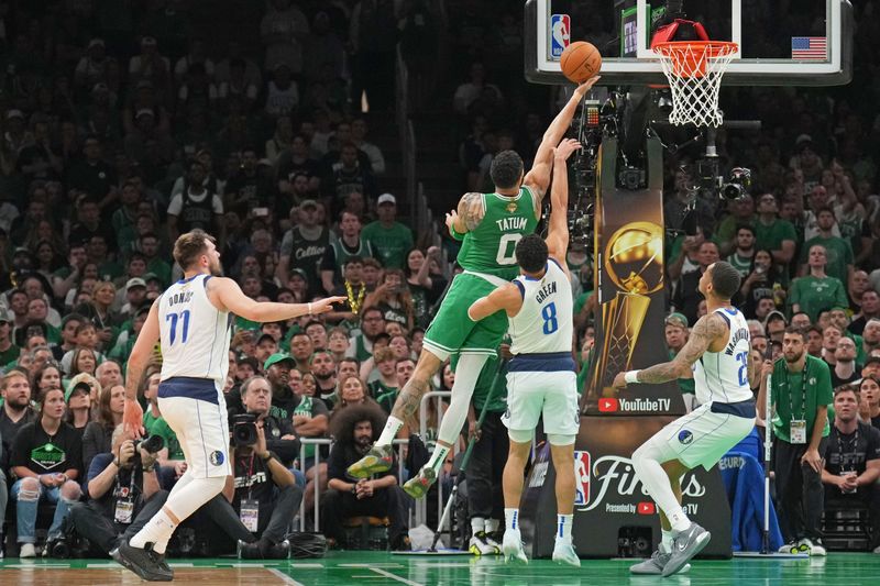 BOSTON, MA - JUNE 17: Jayson Tatum #0 of the Boston Celtics drives to the basket during the game against the Dallas Mavericks during Game 5 of the 2024 NBA Finals on June 17, 2024 at the TD Garden in Boston, Massachusetts. NOTE TO USER: User expressly acknowledges and agrees that, by downloading and or using this photograph, User is consenting to the terms and conditions of the Getty Images License Agreement. Mandatory Copyright Notice: Copyright 2024 NBAE  (Photo by Jesse D. Garrabrant/NBAE via Getty Images)