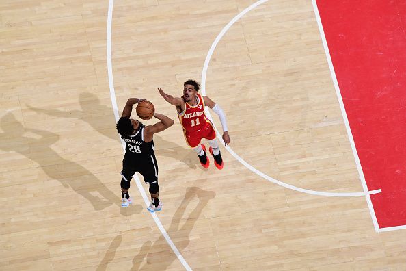 ATLANTA, GA - DECEMBER 6: Spencer Dinwiddie #26 of the Brooklyn Nets shoots a three point basket during the game against the Atlanta Hawks on December 6, 2023 at State Farm Arena in Atlanta, Georgia.  NOTE TO USER: User expressly acknowledges and agrees that, by downloading and/or using this Photograph, user is consenting to the terms and conditions of the Getty Images License Agreement. Mandatory Copyright Notice: Copyright 2023 NBAE (Photo by Scott Cunningham/NBAE via Getty Images)