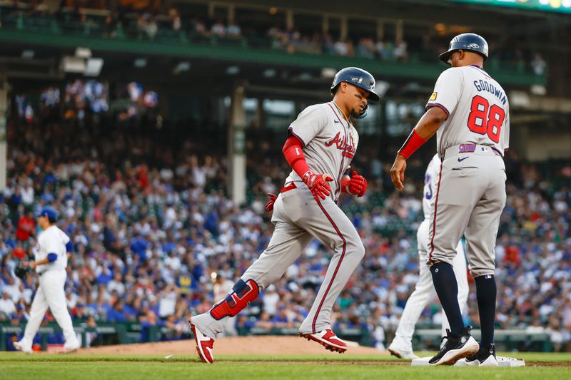 May 21, 2024; Chicago, Illinois, USA; Atlanta Braves shortstop Orlando Arcia (11) rounds the bases after hitting a two-run home run against the Chicago Cubs during the second inning at Wrigley Field. Mandatory Credit: Kamil Krzaczynski-USA TODAY Sports