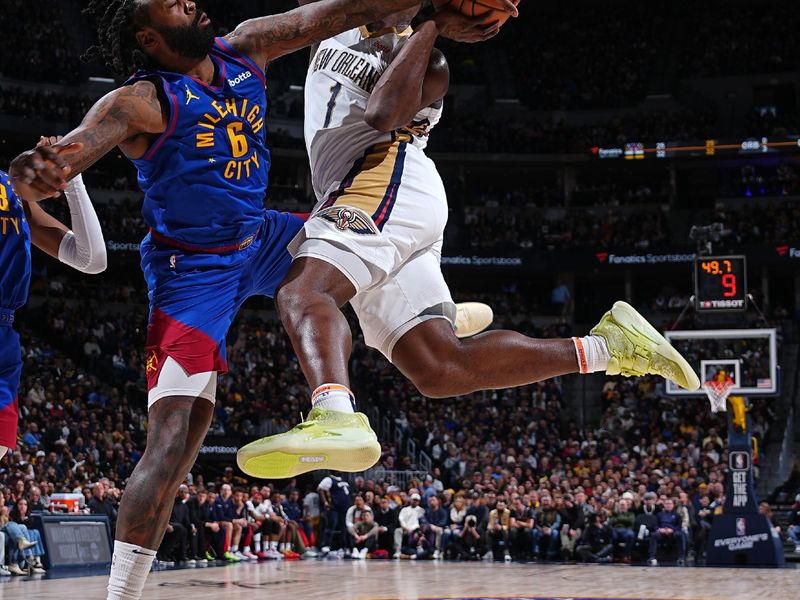 DENVER, CO - JANUARY 12: DeAndre Jordan #6 of the Denver Nuggets blocks the shot of Zion Williamson #1 of the New Orleans Pelicans on January 12, 2024 at the Ball Arena in Denver, Colorado. NOTE TO USER: User expressly acknowledges and agrees that, by downloading and/or using this Photograph, user is consenting to the terms and conditions of the Getty Images License Agreement. Mandatory Copyright Notice: Copyright 2024 NBAE (Photo by Garrett Ellwood/NBAE via Getty Images)