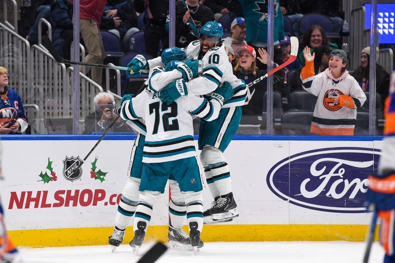 Dec 5, 2023; Elmont, New York, USA; San Jose Sharks left wing Anthony Duclair (10) and San Jose Sharks left wing William Eklund (72) celebrate the game tying goal by  San Jose Sharks center Tomas Hertl (48) against the New York Islanders during the third period at UBS Arena. Mandatory Credit: Dennis Schneidler-USA TODAY Sports