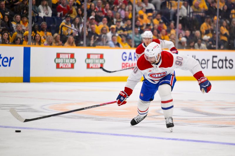 Mar 28, 2026; Nashville, Tennessee, USA;  Montreal Canadiens center Joe Veleno (90) skates with the puck against the Nashville Predators during the second period Gat Bridgestone Arena. Mandatory Credit: Steve Roberts-Imagn Images