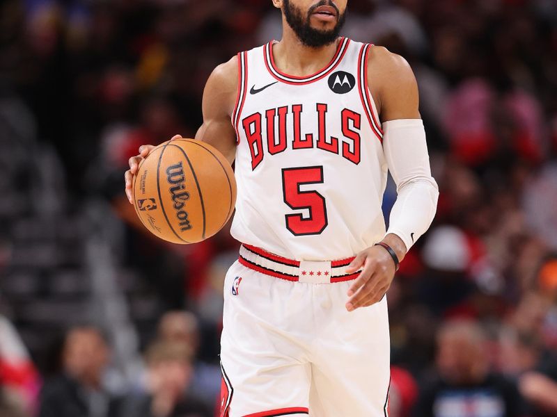 CHICAGO, ILLINOIS - DECEMBER 20: Jevon Carter #5 of the Chicago Bulls dribbles up the court against the Los Angeles Lakers during the second half at the United Center on December 20, 2023 in Chicago, Illinois. NOTE TO USER: User expressly acknowledges and agrees that, by downloading and or using this photograph, User is consenting to the terms and conditions of the Getty Images License Agreement.  (Photo by Michael Reaves/Getty Images)