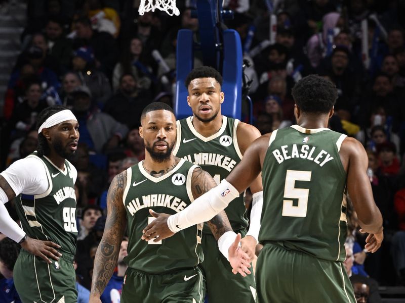 PHILADELPHIA, PA - FEBRUARY 25: Damian Lillard #0 high fives Malik Beasley #5 of the Milwaukee Bucks during the game against the Philadelphia 76ers on February 25, 2024 at the Wells Fargo Center in Philadelphia, Pennsylvania NOTE TO USER: User expressly acknowledges and agrees that, by downloading and/or using this Photograph, user is consenting to the terms and conditions of the Getty Images License Agreement. Mandatory Copyright Notice: Copyright 2024 NBAE (Photo by David Dow/NBAE via Getty Images)