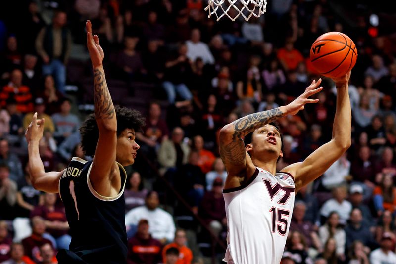 Mar 2, 2024; Blacksburg, Virginia, USA; Virginia Tech Hokies center Lynn Kidd (15) shoots the ball against Wake Forest Demon Deacons forward Marqus Marion (1) during the second half at Cassell Coliseum. Mandatory Credit: Peter Casey-USA TODAY Sports