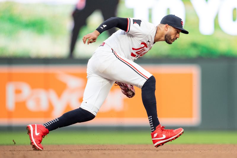 Jul 2, 2024; Minneapolis, Minnesota, USA; Minnesota Twins shortstop Carlos Correa (4) fields a ground ball hit by Detroit Tigers catcher Jake Rogers (34) in the seventh inning at Target Field. Mandatory Credit: Matt Blewett-USA TODAY Sports