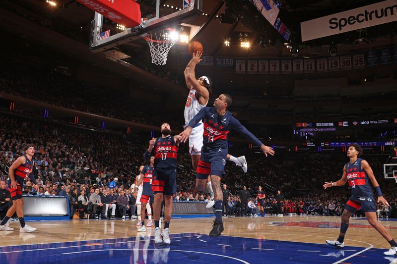 NEW YORK, NY - NOVEMBER 18: Jericho Sims #20 of the New York Knicks dunks the ball during the game against the Washington Wizards on November 18, 2024 at Madison Square Garden in New York City, New York.  NOTE TO USER: User expressly acknowledges and agrees that, by downloading and or using this photograph, User is consenting to the terms and conditions of the Getty Images License Agreement. Mandatory Copyright Notice: Copyright 2024 NBAE  (Photo by Nathaniel S. Butler/NBAE via Getty Images)