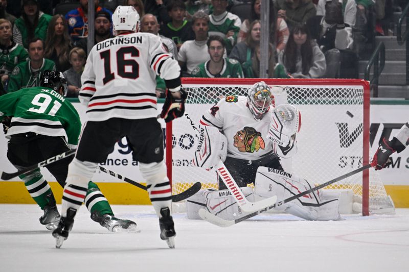 Oct 26, 2024; Dallas, Texas, USA; Dallas Stars center Tyler Seguin (91) shoots the puck on net as Chicago Blackhawks goaltender Petr Mrazek (34) defends the goal during the first period at the American Airlines Center. Mandatory Credit: Jerome Miron-Imagn Images