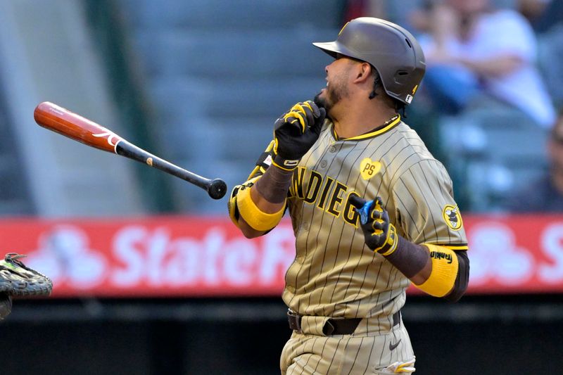 Jun 4, 2024; Anaheim, California, USA;  San Diego Padres second baseman Luis Arraez (4) drops his bat after he was hit by a pitch in the third inning against the Los Angeles Angels at Angel Stadium. Mandatory Credit: Jayne Kamin-Oncea-USA TODAY Sports