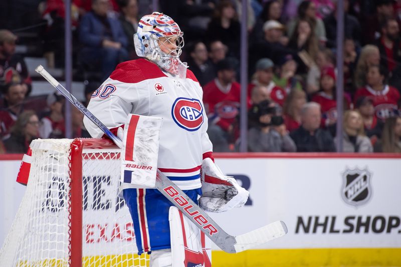 Apr 13, 2024; Ottawa, Ontario, CAN; Montreal Canadiens goalie Cayden Primeau (30) relaxes during a break in action in the first period against the Ottawa Senators at the Canadian Tire Centre. Mandatory Credit: Marc DesRosiers-USA TODAY Sports