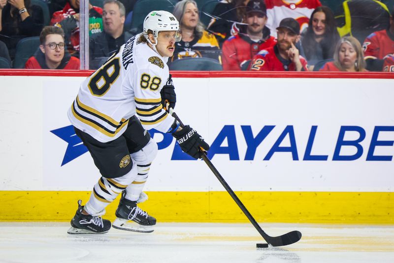 Feb 22, 2024; Calgary, Alberta, CAN; Boston Bruins right wing David Pastrnak (88) skates with the puck against the Calgary Flames during the second period at Scotiabank Saddledome. Mandatory Credit: Sergei Belski-USA TODAY Sports