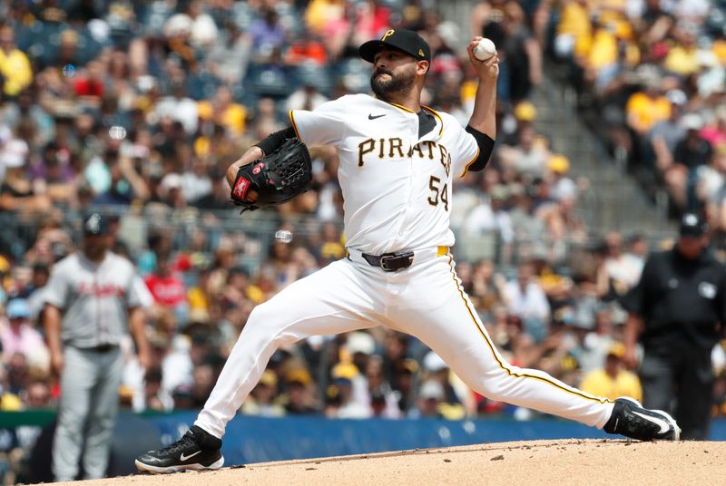 May 26, 2024; Pittsburgh, Pennsylvania, USA;  Pittsburgh Pirates starting pitcher Martín Pérez (54) delivers a pitch against the Atlanta Braves during the first inning at PNC Park. Mandatory Credit: Charles LeClaire-USA TODAY Sports