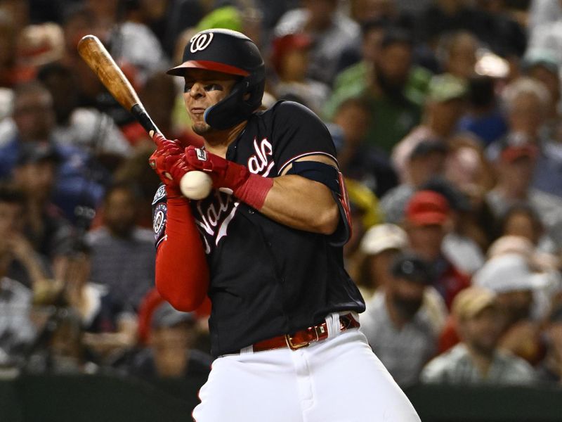 Aug 16, 2023; Washington, District of Columbia, USA; Washington Nationals designated hitter Joey Meneses (45) is hit by a pitch against the Boston Red Sox during the eighth inning at Nationals Park. Mandatory Credit: Brad Mills-USA TODAY Sports