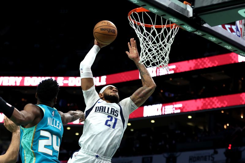 CHARLOTTE, NORTH CAROLINA - APRIL 09: Daniel Gafford #21 of the Dallas Mavericks dunks the ball during the second half of an NBA game against the Charlotte Hornets at Spectrum Center on April 09, 2024 in Charlotte, North Carolina. NOTE TO USER: User expressly acknowledges and agrees that, by downloading and or using this photograph, User is consenting to the terms and conditions of the Getty Images License Agreement. (Photo by David Jensen/Getty Images)