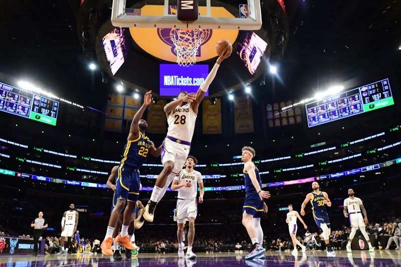 LOS ANGELES, CA - MACH 16: Rui Hachimura #28 of the Los Angeles Lakers drives to the basket during the game against the Golden State Warriors on March 16, 2024 at Crypto.Com Arena in Los Angeles, California. NOTE TO USER: User expressly acknowledges and agrees that, by downloading and/or using this Photograph, user is consenting to the terms and conditions of the Getty Images License Agreement. Mandatory Copyright Notice: Copyright 2024 NBAE (Photo by Adam Pantozzi/NBAE via Getty Images)