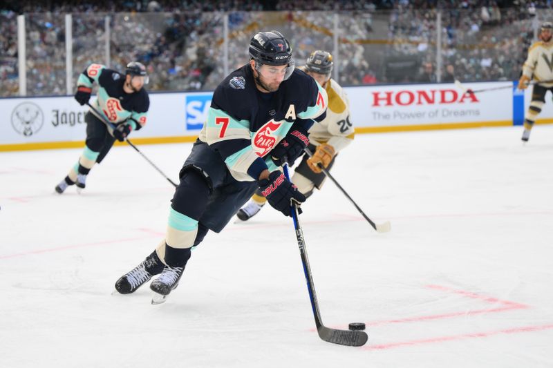 Jan 1, 2024; Seattle, Washington, USA; Seattle Kraken right wing Jordan Eberle (7) plays the puck against the Vegas Golden Knights during the 3rd period in the 2024 Winter Classic ice hockey game at T-Mobile Park. Mandatory Credit: Steven Bisig-USA TODAY Sports