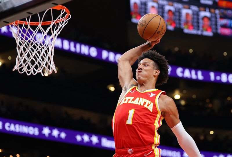 ATLANTA, GEORGIA - FEBRUARY 10:  Jalen Johnson #1 of the Atlanta Hawks dunks against the Houston Rockets during the first quarter at State Farm Arena on February 10, 2024 in Atlanta, Georgia.  NOTE TO USER: User expressly acknowledges and agrees that, by downloading and/or using this photograph, user is consenting to the terms and conditions of the Getty Images License Agreement.  (Photo by Kevin C. Cox/Getty Images)