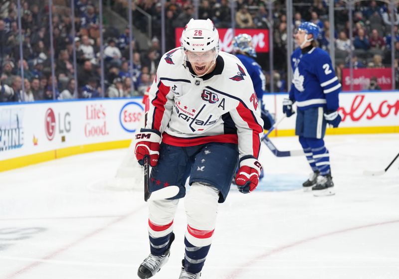 Dec 6, 2024; Toronto, Ontario, CAN; Washington Capitals center Nic Dowd (26) celebrates after scoring a goal against the Toronto Maple Leafs during the second period at Scotiabank Arena. Mandatory Credit: Nick Turchiaro-Imagn Images