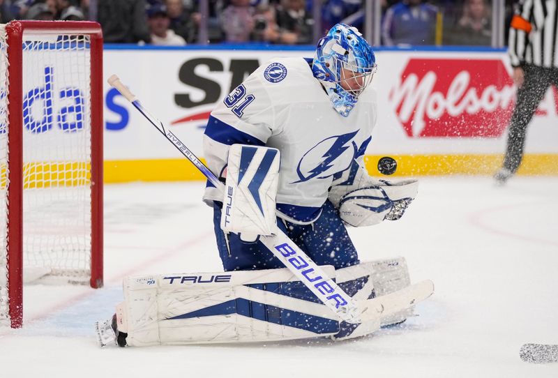 Nov 6, 2023; Toronto, Ontario, CAN; Tampa Bay Lightning goaltender Jonas Johansson (31) makes a save against the Toronto Maple Leafs during the first period at Scotiabank Arena. Mandatory Credit: John E. Sokolowski-USA TODAY Sports