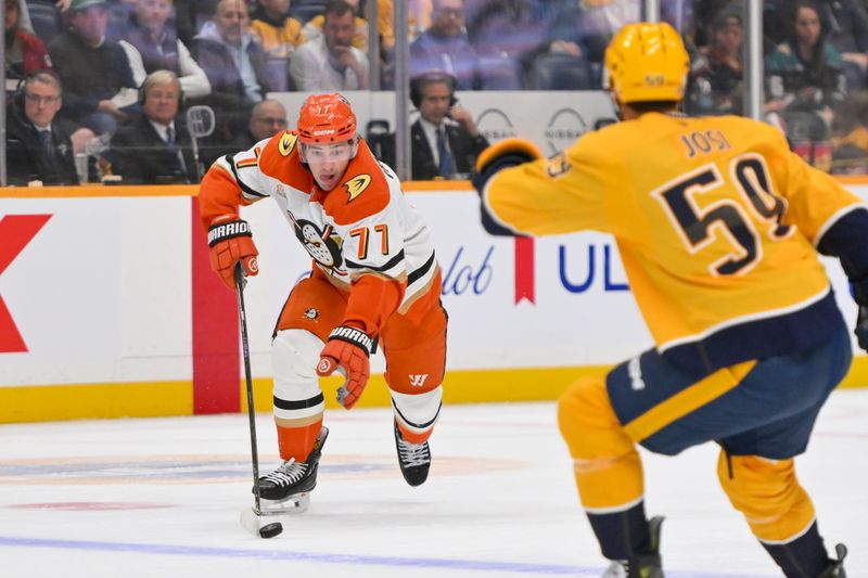 Oct 21, 2025; Nashville, Tennessee, USA;  Anaheim Ducks right wing Frank Vatrano (77) skates with the puck against the Nashville Predators during the second period at Bridgestone Arena. Mandatory Credit: Steve Roberts-Imagn Images