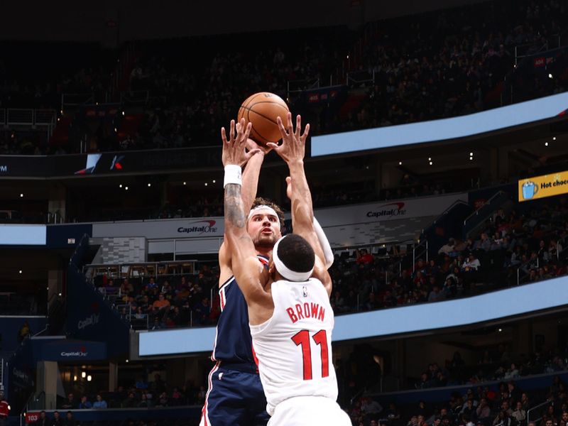 WASHINGTON, DC -? MARCH 23:  Corey Kispert #24 of the Washington Wizards shoots the ball during the game  on March 23, 2024 at Capital One Arena in Washington, DC. NOTE TO USER: User expressly acknowledges and agrees that, by downloading and or using this Photograph, user is consenting to the terms and conditions of the Getty Images License Agreement. Mandatory Copyright Notice: Copyright 2024 NBAE (Photo by Kenny Giarla/NBAE via Getty Images)