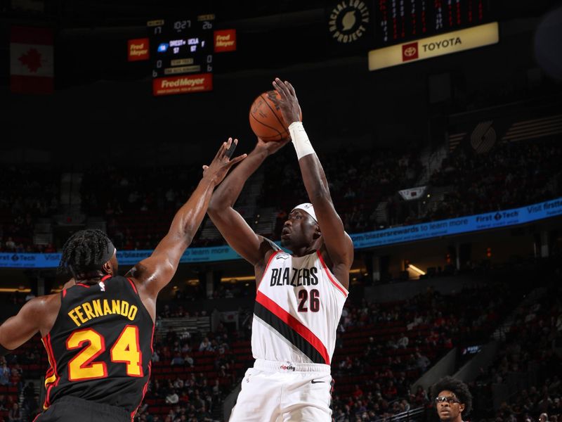 PORTLAND, OR - MARCH 13:  Duop Reath #26 of the Portland Trail Blazers shoots the ball during the game  on March 13, 2024 at the Moda Center Arena in Portland, Oregon. NOTE TO USER: User expressly acknowledges and agrees that, by downloading and or using this photograph, user is consenting to the terms and conditions of the Getty Images License Agreement. Mandatory Copyright Notice: Copyright 2024 NBAE (Photo by Cameron Browne/NBAE via Getty Images)