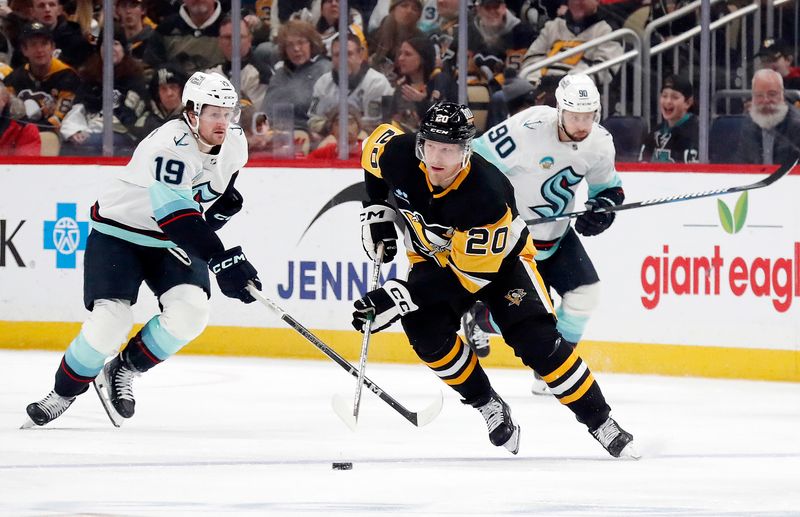 Jan 15, 2024; Pittsburgh, Pennsylvania, USA; Pittsburgh Penguins center Lars Eller (20) skates with the puck against the Seattle Kraken during the third period at PPG Paints Arena. Mandatory Credit: Charles LeClaire-USA TODAY Sports