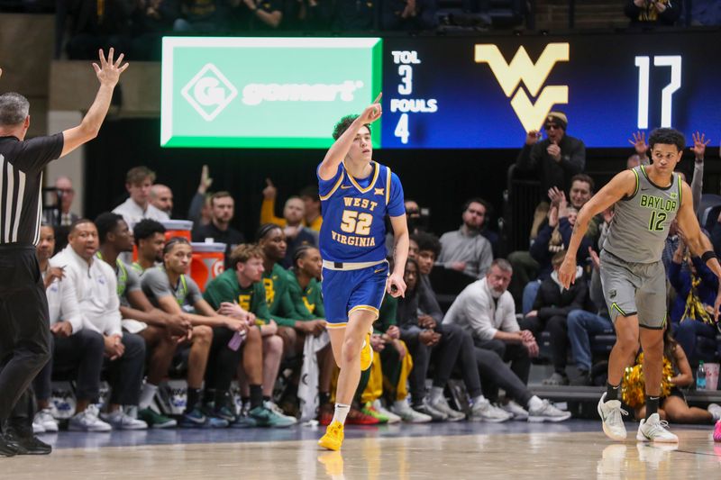 Jan 31, 2026; Morgantown, West Virginia, USA; West Virginia Mountaineers guard Treysen Eaglestaff (52) celebrates after a made three point basket during the first half against the Baylor Bears at Hope Coliseum. Mandatory Credit: Ben Queen-Imagn Images