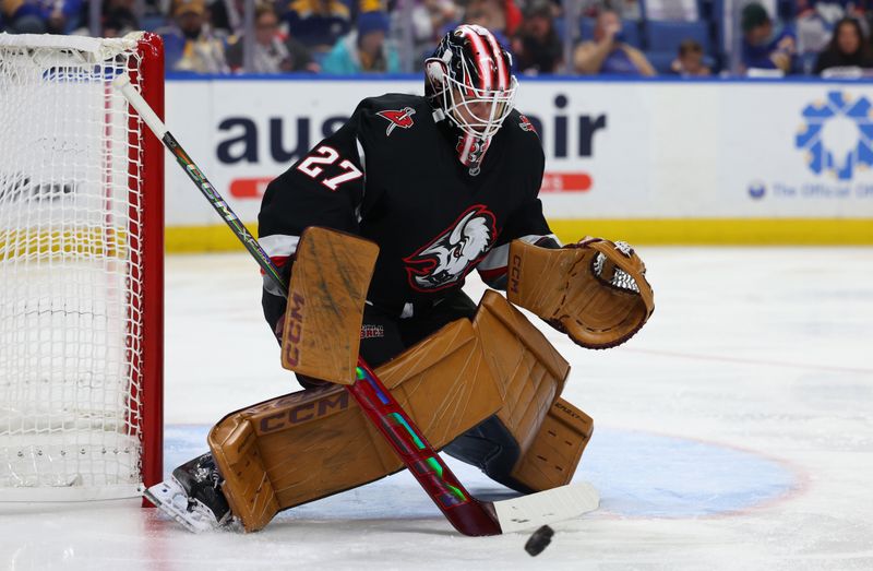 Nov 1, 2024; Buffalo, New York, USA;  Buffalo Sabres goaltender Devon Levi (27) looks to make a save during the first period against the New York Islanders at KeyBank Center. Mandatory Credit: Timothy T. Ludwig-Imagn Images