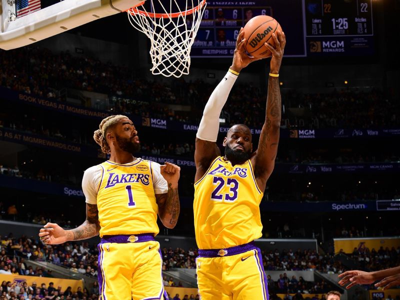 LOS ANGELES, CA - NOVEMBER 13: LeBron James #23 of the Los Angeles Lakers rebounds the ball during the game against the Memphis Grizzlies on November 13, 2024 at Crypto.Com Arena in Los Angeles, California. NOTE TO USER: User expressly acknowledges and agrees that, by downloading and/or using this Photograph, user is consenting to the terms and conditions of the Getty Images License Agreement. Mandatory Copyright Notice: Copyright 2024 NBAE (Photo by Adam Pantozzi/NBAE via Getty Images)