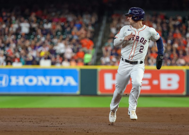 Jul 11, 2024; Houston, Texas, USA;Houston Astros third baseman Alex Bregman (2) runs from second to third base against the Miami Marlins in the first inning at Minute Maid Park. Mandatory Credit: Thomas Shea-USA TODAY Sports