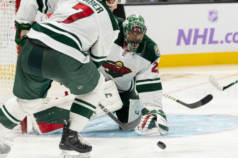 Nov 7, 2024; San Jose, California, USA;  Minnesota Wild goaltender Marc-Andre Fleury (29) watches the puck during the second period against the San Jose Sharks at SAP Center at San Jose. Mandatory Credit: Stan Szeto-Imagn Images