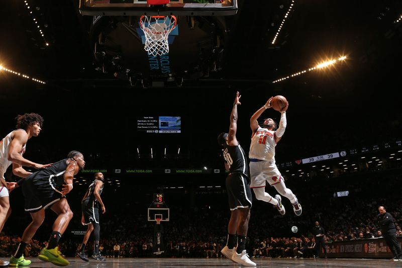 BROOKLYN, NY - JANUARY 23: Jalen Brunson #11 of the New York Knicks drives to the basket during the game against the Brooklyn Nets on January 23, 2024 at Barclays Center in Brooklyn, New York. NOTE TO USER: User expressly acknowledges and agrees that, by downloading and or using this Photograph, user is consenting to the terms and conditions of the Getty Images License Agreement. Mandatory Copyright Notice: Copyright 2024 NBAE (Photo by Nathaniel S. Butler/NBAE via Getty Images)