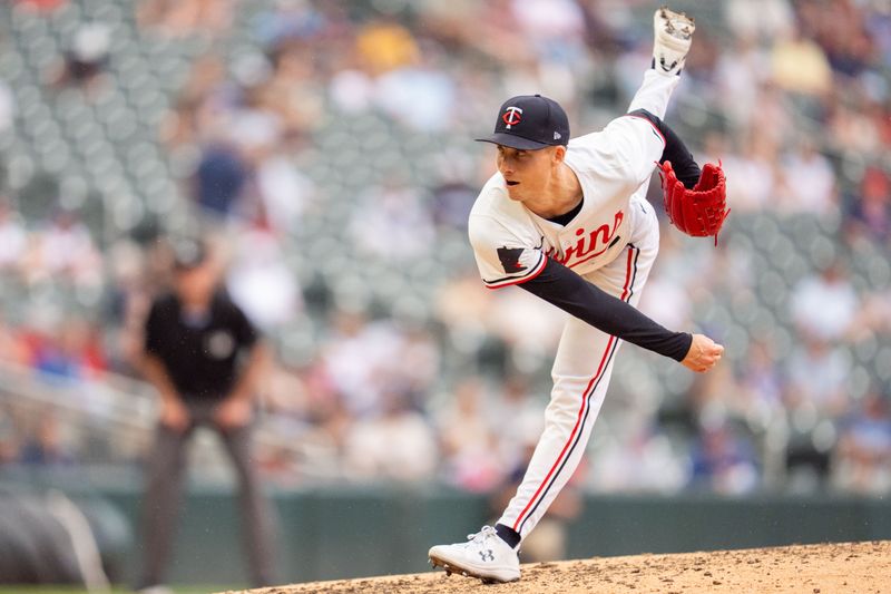 Jun 7, 2025; Minneapolis, Minnesota, USA; Minnesota Twins pitcher Griffin Jax (22) pitches to Toronto Blue Jays third base Addison Barger (47) in the eighth inning at Target Field. Mandatory Credit: Matt Blewett-Imagn Images