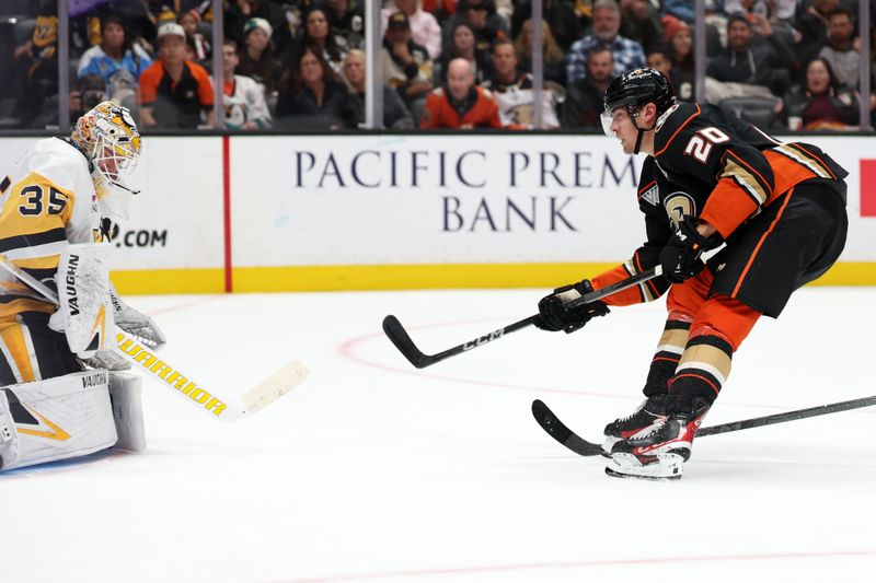 Nov 7, 2023; Anaheim, California, USA; Anaheim Ducks right wing Brett Leason (20) shoots the puck against Pittsburgh Penguins goaltender Tristan Jarry (35) during the second period at Honda Center. Mandatory Credit: Kiyoshi Mio-USA TODAY Sports