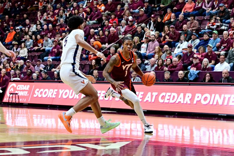 Feb 15, 2025; Blacksburg, Virginia, USA; Virginia Tech Hokies forward Tobi Lawal (1) drives toward the basket as Virginia Cavaliers forward Jacob Cofie (5) defends during the first half at Cassell Coliseum. Mandatory Credit: Brian Bishop-Imagn Images