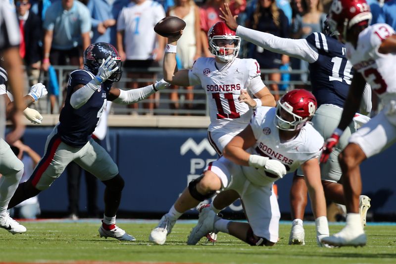Oct 26, 2024; Oxford, Mississippi, USA; Oklahoma Sooners quarterback Jackson Arnold (11) passes the ball during the first half against the Mississippi Rebels at Vaught-Hemingway Stadium. Mandatory Credit: Petre Thomas-Imagn Images