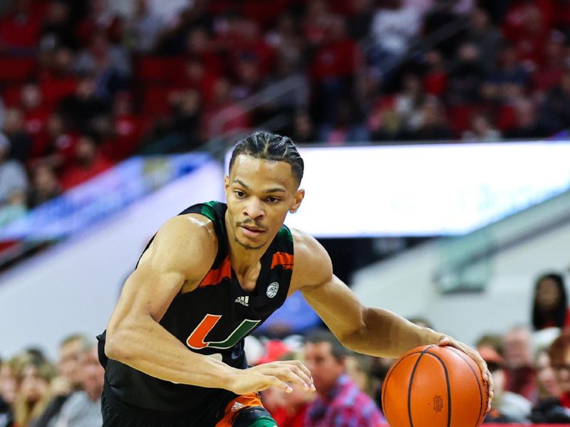 Jan 14, 2023; Raleigh, North Carolina, USA; Miami Hurricanes guard Isaiah Wong (2) runs with the ball during the second half against North Carolina State Wolfpack at PNC Arena. Mandatory Credit: Jaylynn Nash-USA TODAY Sports