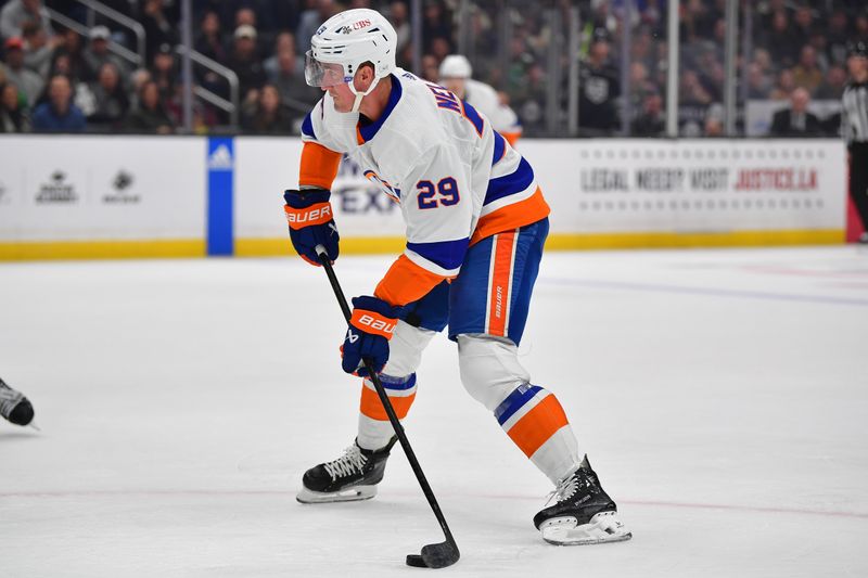 Mar 11, 2024; Los Angeles, California, USA; New York Islanders right wing Cal Clutterbuck (15) controls the puck against the Los Angeles Kings during the first period at Crypto.com Arena. Mandatory Credit: Gary A. Vasquez-USA TODAY Sports