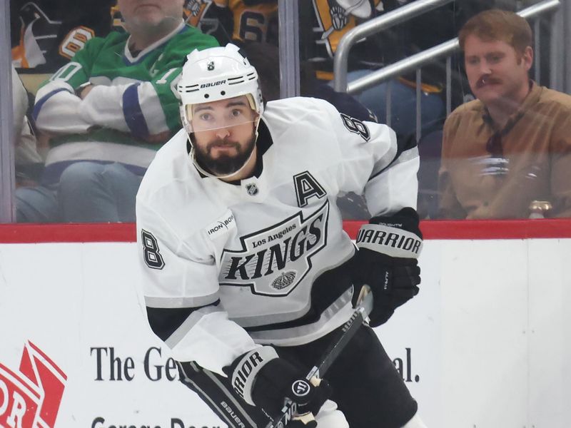 Nov 9, 2025; Pittsburgh, Pennsylvania, USA;  Los Angeles Kings defenseman Drew Doughty (8) skates up ice with the puck against the Pittsburgh Penguins during the second period at PPG Paints Arena. Mandatory Credit: Charles LeClaire-Imagn Images