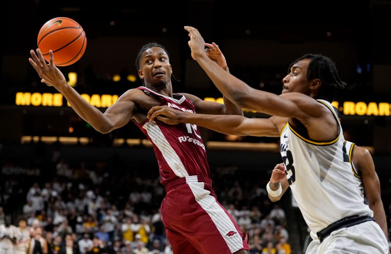 Jan 31, 2024; Columbia, Missouri, USA; Arkansas Razorbacks guard Tramon Mark (12) and Missouri Tigers forward Aidan Shaw (23) fight for a loose ball during the second half at Mizzou Arena. Mandatory Credit: Jay Biggerstaff-USA TODAY Sports