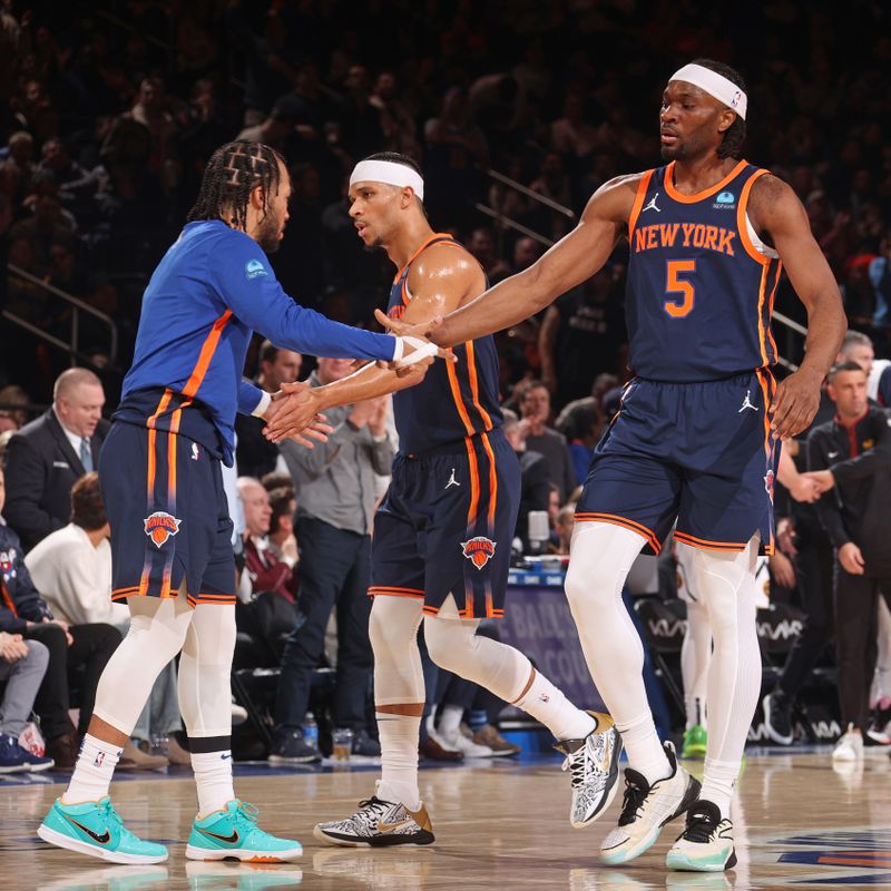 NEW YORK, NY - JANUARY 25: Jalen Brunson #11 and Precious Achiuwa #5 of the New York Knicks high five during the game against the Denver Nuggets on January 25, 2024 at Madison Square Garden in New York City, New York.  NOTE TO USER: User expressly acknowledges and agrees that, by downloading and or using this photograph, User is consenting to the terms and conditions of the Getty Images License Agreement. Mandatory Copyright Notice: Copyright 2024 NBAE  (Photo by Nathaniel S. Butler/NBAE via Getty Images)