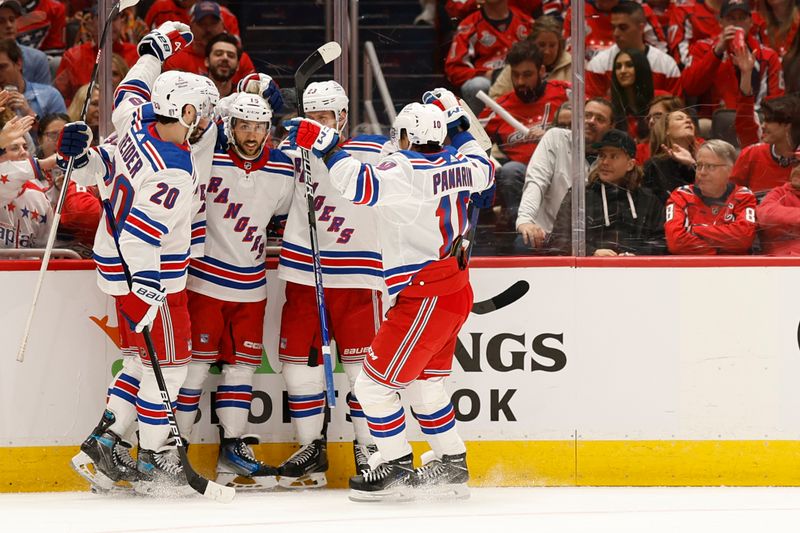 Apr 26, 2024; Washington, District of Columbia, USA; New York Rangers center Vincent Trocheck (16) celebrates with teammates after scoring a goal against the Washington Capitals in the second period in game three of the first round of the 2024 Stanley Cup Playoffs at Capital One Arena. Mandatory Credit: Geoff Burke-USA TODAY Sports